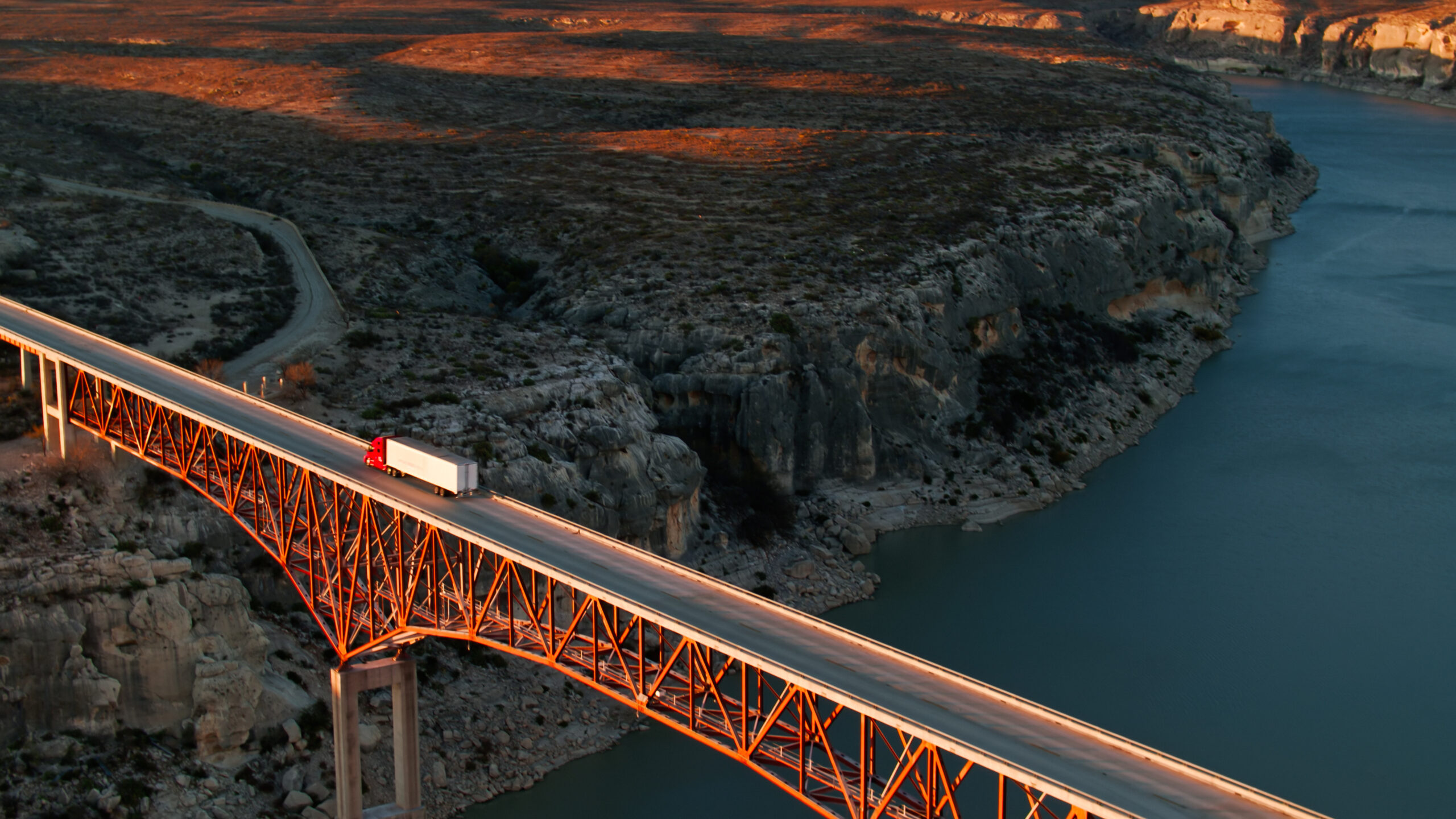 High Angle Drone Shot of Truck Crossing Pecos River Bridge